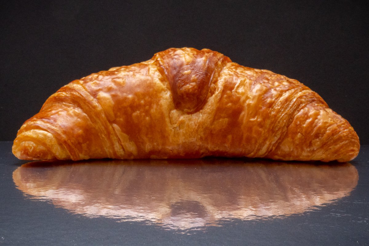 crosoint on a mirroed surface with dark backgroun